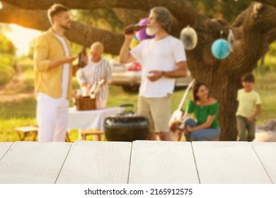 Empty Wooden Table At Barbecue Party Outdoors