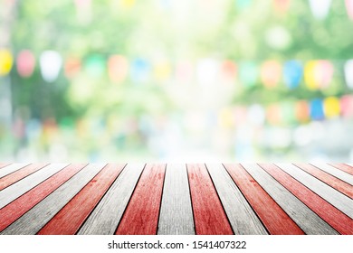 Empty Wooden Table With Birhday Party In Garden Background Blurred.