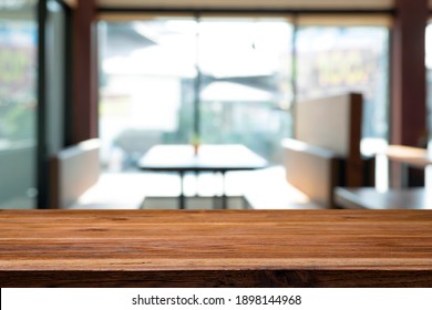 Empty Wooden Table With Blur Background Of Office And Meeting Room.