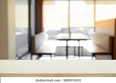 Empty Wooden Table With Blur Background Of Office And Meeting Room.