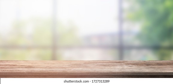 Empty wooden table and blur glass wall background window room interior decoration background, product montage display,can be used for display or montage your products. - Powered by Shutterstock