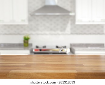 Empty wooden table and blurred kitchen background, product display - Shutterstock ID 281312033