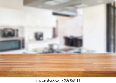 Empty wooden table and blurred kitchen background, product  montage display  - Shutterstock ID 302958413