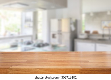 Empty wooden table and blurred kitchen background, product  montage display  - Shutterstock ID 306716102