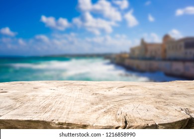 Empty Wooden Table With Blurred Mediterranean Seascape In Background. Ready For Product Montage.