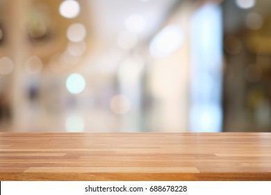 Empty Wooden Table And Blurred  Modern Kitchen Cafe Background, Restaurants. Ready For Product Montage, Bokeh , Light