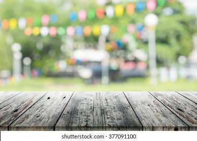 Empty Wooden Table With Blurred Party On Background