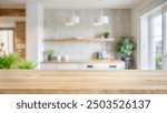 Empty wooden table with blurred view of scandinavian living room.