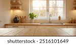 Empty wooden table with the bright white interior of the kitchen as a blurred background behind the bokeh golden sunshin