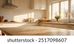 Empty wooden table with the bright white interior of the kitchen as a blurred background behind the bokeh golden sunshin