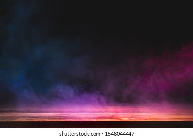 empty wooden table with colorful smoke float up on dark background - Shutterstock ID 1548044447