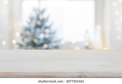 Empty wooden table in front of blurred winter festive background - Powered by Shutterstock