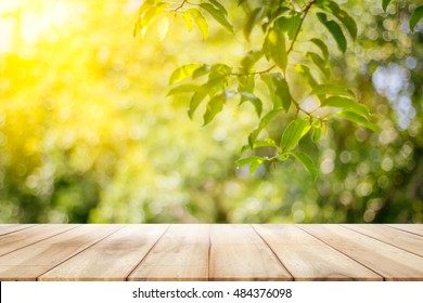 Empty wooden table with garden bokeh background with a country outdoor theme,Template mock up for display of product - Shutterstock ID 484376098