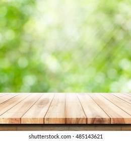 Empty Wooden Table With Garden Bokeh For A Catering Or Food Background With A Country Outdoor Theme,Template Mock Up For Display Of Product