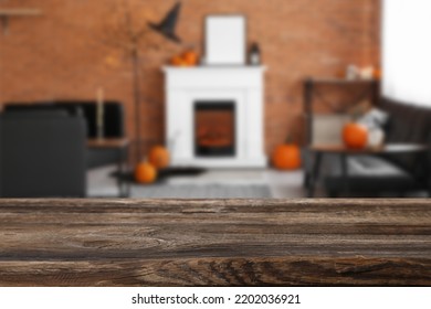 Empty Wooden Table In Living Room Decorated For Halloween Party