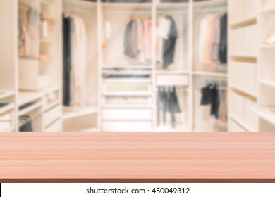 Empty Wooden Table On A Background Blur Closet In The Room  For Display Or Montage Your Products