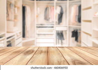 Empty Wooden Table On A Background Blur Closet In The Room  For Display Or Montage Your Products