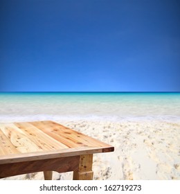 Empty Wooden Table On The Beach