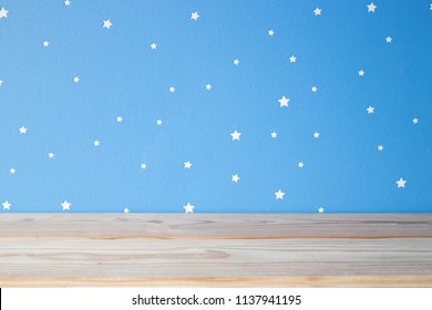 empty wooden table on the blue sky kids background