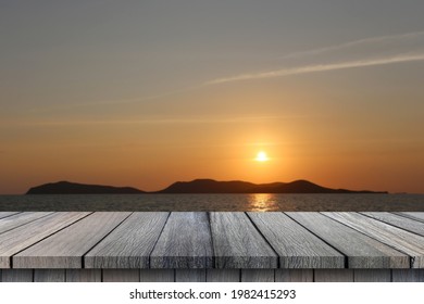 Empty wooden table on sky at sunset and mountain background for design in your work summer concept.