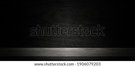 Empty wooden table on wall dark background,perspective wooden floor shelf table,used as a studio background wall to display your products.