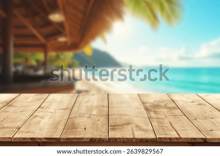 Empty wooden table with open space for product placement or branding. In the background blurred summer scene with sandy coastline and beach cafe and the blue sea under sunny sky.