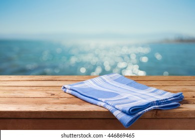 Empty Wooden Table Over Sea Beach Bokeh Background. Summer Picnic On Beach Background