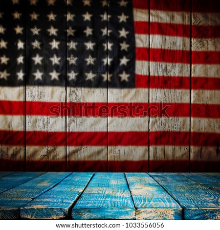 Empty wooden table over vintage USA flag background. Ready for montage. USA national holidays concept.
