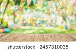 Empty wooden table with party in backyard, blurred  background with festive bunting