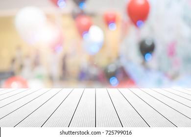 Empty Wooden Table With Party In Wedding Background Blurred.