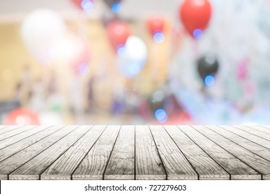 Empty Wooden Table With Party In Wedding Background Blurred.