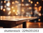 Empty wooden table platform and blurred background bokeh of at bar restaurant at night. Can be used for display or montage your products.Mock up for space.