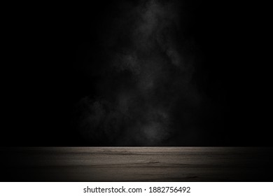 empty wooden table with smoke float up on dark background - Shutterstock ID 1882756492
