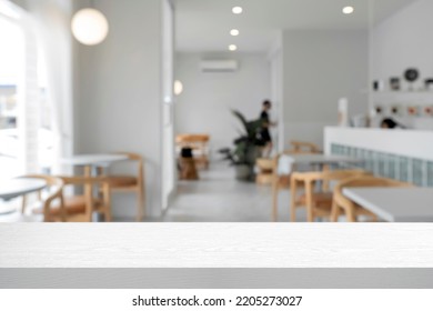 Empty wooden table space platform and blurred cafe or restaurant background for product display montage. - Shutterstock ID 2205273027