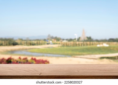 Empty wooden table space platform and blurred farm or flower garden background for product display montage. - Shutterstock ID 2258020327
