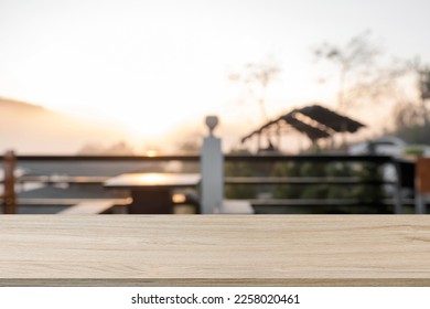 Empty wooden table space platform and blurred resort or restaurant background for product display montage. - Shutterstock ID 2258020461