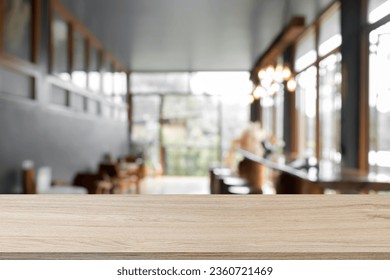 Empty wooden table space platform and blurry cafe or restaurant background for product display montage. - Powered by Shutterstock