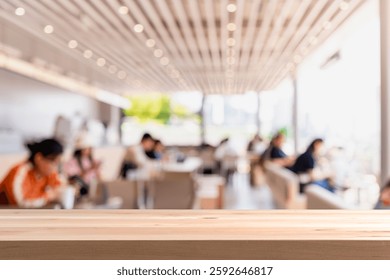 Empty wooden table space platform and blurry defocused restaurant interior
