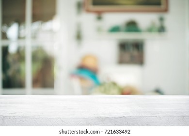 Empty wooden table space platform and blurred resturant or coffee shop background for product display montage