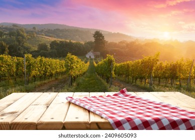 The empty wooden table top with blur background of vineyard. Exuberant image. High quality photo - Powered by Shutterstock