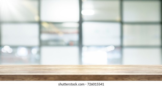 Empty Wooden Table Top With Blur Coffeeshop Window Background, Panoramic Banner. Can Be Used Product Display. 