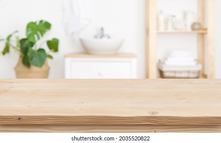 Empty Wooden Table Top And Blurred Bathroom Interior As Background