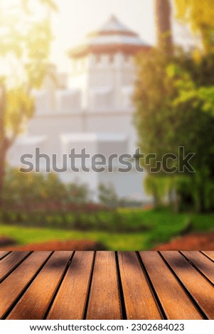 Empty wooden table top and blurred background beautiful old fort and can be used for displaying or editing your products.