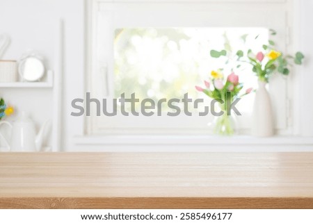Empty wooden table top with free space on blurred decorated with colorful spring flowers window background