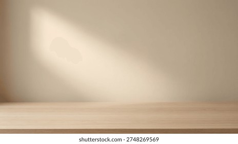Empty wooden table top surface with beige wall background and aesthetic sunlight shadow. Minimalist interior mockup for product display presentation with copy space