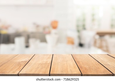 Empty Wooden Table And White Modern Kitchen Cafe Background,resturant. Ready For Product Montage