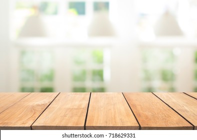 Empty Wooden Table And White Modern Kitchen Cafe Background,resturant. Ready For Product Montage