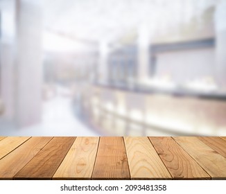 Empty Wooden Tabletop With Blur Image Of A Counter Bar In The Hotel Or Bar Interior Luxury Lobby Empty In The Daytime Background, Copy Space For Your Text Ready For Product Promotion Display Montage.