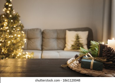 Empty Wooden Tabletop With Candles In Living Room With Christmas Tree. Xmas Cozy Holiday At Home Interior.