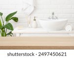 Empty wooden top table with blurred bathroom interior background for product display montage